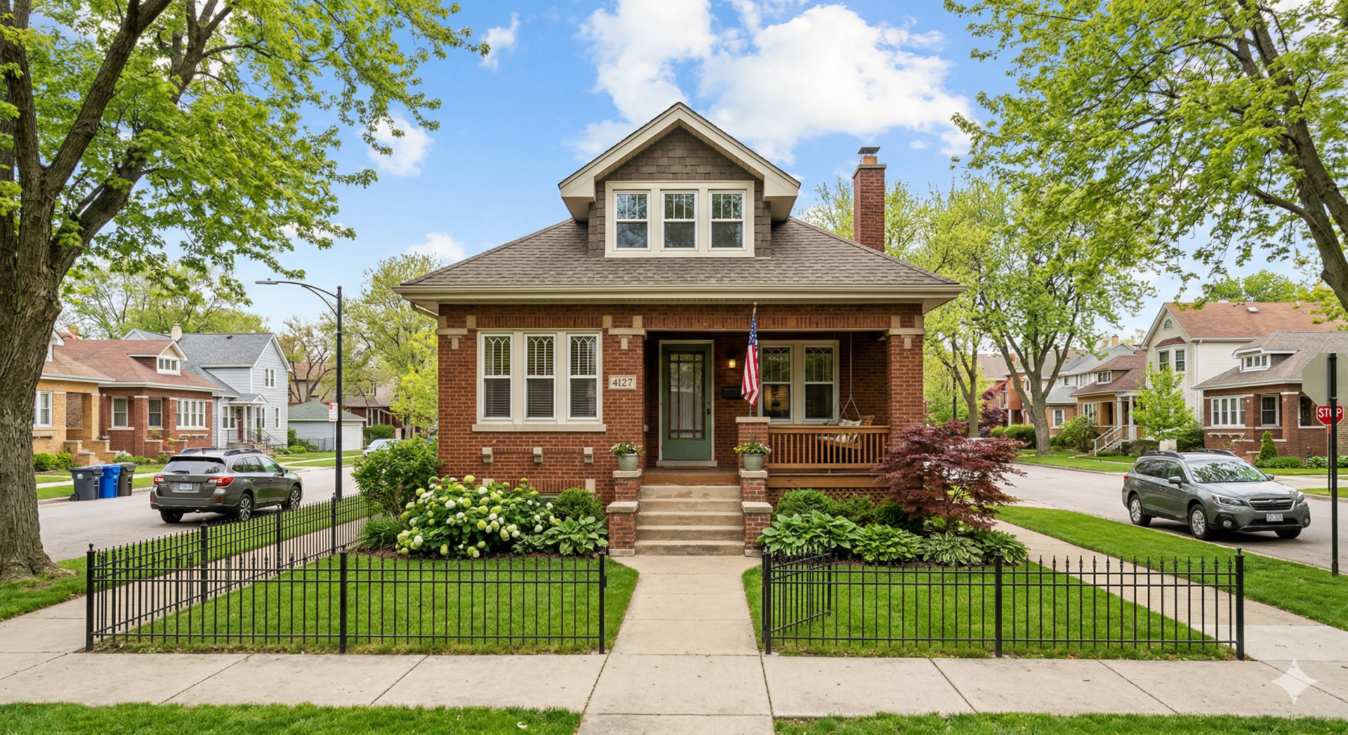 Elegant modern house exterior featuring brick facade and lush landscaping.